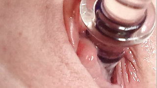 Granny with a big clit and wet pussy has an intense orgasm