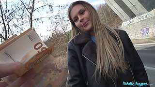 Guy and girl have fun in his car.