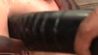 While two delicious and sexy lesbians are playing with their pussies, two black, craving cocks join the group