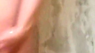 Busty GILF Watering and Pissing in the Shower