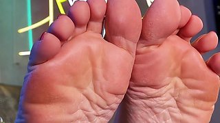 My Bare Wrinkled Soles and Toes on the Table Closeup