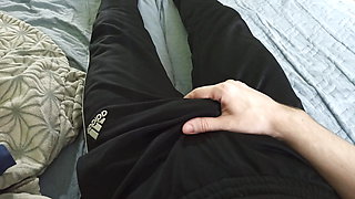 Guy in pants stroking himself and enjoying himself