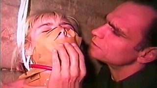 Totally helpless blonde dominated and humiliated in a moldy basement