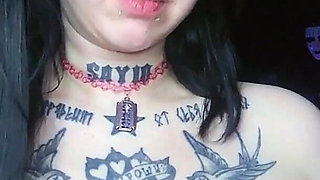 Sexy Alternative Brunette Drinking Sparkling Water and Burping