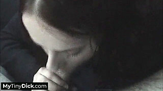 A stunning brunette pleases his small dick in the car
