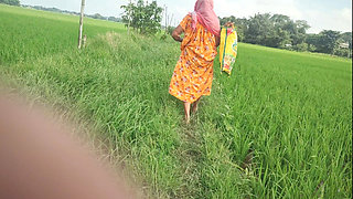 Village granny pee in the field