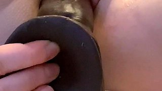 Brunette enjoys the toy on gaping pussy while masturbating