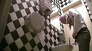 Fine white shiny booty of a stranger girl filmed in the toilet