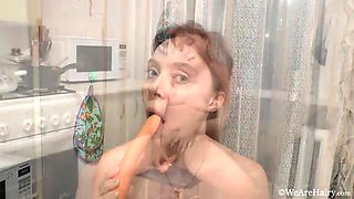 Trixie masturbates in her kitchen with a carrot - WeAreHairy