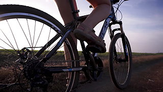 Cycling Outdoors And Flashing Ass In Miniskirt