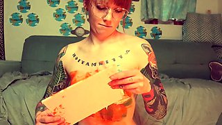 Amateur redhead Jacqueline with glasses masturbates