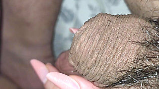 Step mom grabs and squeeze step son balls in bed