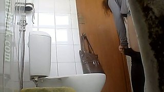 Redhead young white girl pisses in the toilet room and gets recorded on hidden cam