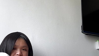 Chubby asian woman with a very phat pussy fucks herself with white dildo