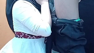 A Lonely Woman Wearing a Hijab in a Boarding