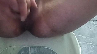Masturbating