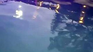 Exotic bombshell performs sensual striptease in the pool