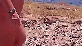 Couple Is Hiking Naked Near the Coast