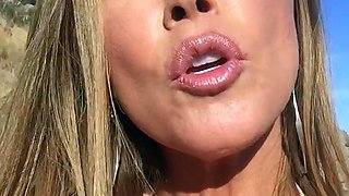Blonde is flashing her big boobs in the outdoors
