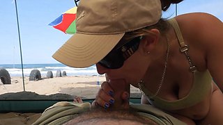 matured tourists have extreme outdoor handsjob on the beach.
