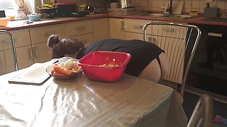 Sexy Dressed Wife Preparing Food in the Kitchen