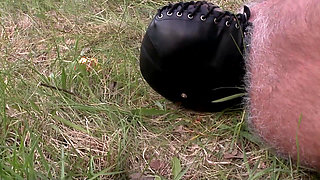 Herrin enslaves man and enjoys foot fetish outdoor