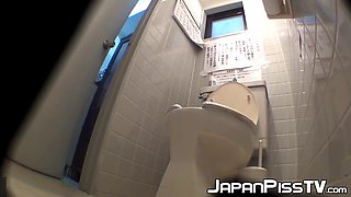 Cute Asian employees unload different streams into the office restroom