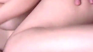 While the girl is busy with a message on the phone, the guy gives her pleasure with a vibrator