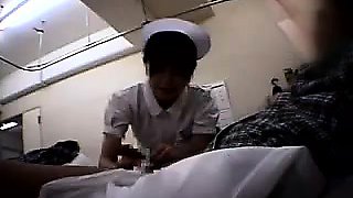 Lucky patient has a lovely Asian nurse working her hands on