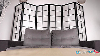 Beautiful Babe Violet Wiggles Her Toes and Massages Her Feet in Nylons as She Is Licking a Lollipop