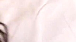 Brunette plays with dildo