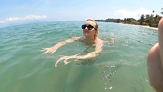 Lovita Fate is a naughty angel in sexy micro bikini on the beach
