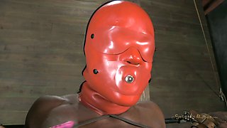 Ebony chick Ashley Starr wears slave hood and gets treated in BDSM way
