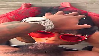 Kinky Ebony dark-haired is throating in front of the camera, while getting down on all fours on the floor