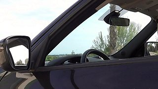 Outdoor solo masturbation scene with curly blonde
