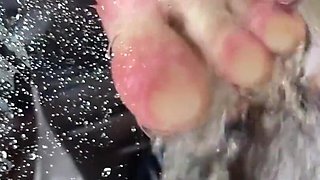Sexy Wet Bare Foot Pressed Against Glass in Shower