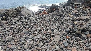Short-haired tattooed girlfriend gives outdoor beach blowjob
