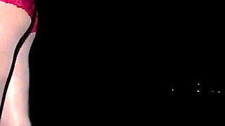 Anna in white shiny pantyhose on the night beach