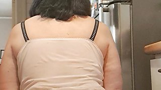 sitting or standing in the kitchen