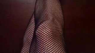 Really nice legs with tiny feet and long sexy toes wearing black Fishnet