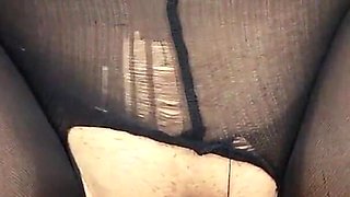 Close-up tight hole in torn pantyhose!