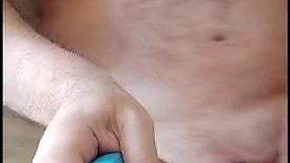 Chubby bear probing his cock with a urethral catheter