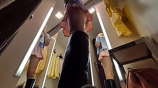 UPskirt view in public fitting room on pussy of blonde with big boobs