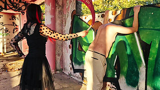 BDSM femdom flogging. Dominatrix Nika punishes her slave at sunset in an abandoned building. Back scratching.