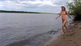 Exhibitionist Blonde Goes Nude on a River Beach