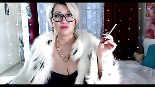 Sexy and pranks of a russian mature smoking bitch in a cool fur coat!
