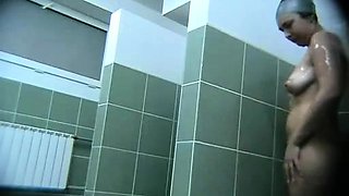 Hot busty on a voyeur video from the swimming pool showers