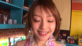 Japanese cutie gives a blowjob in the kitchen