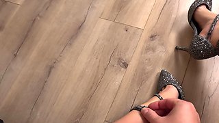 The Girl Clicks Her Heels in the Floor