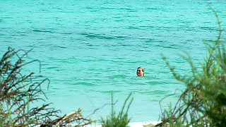 Watching on the beach as Isa has fun